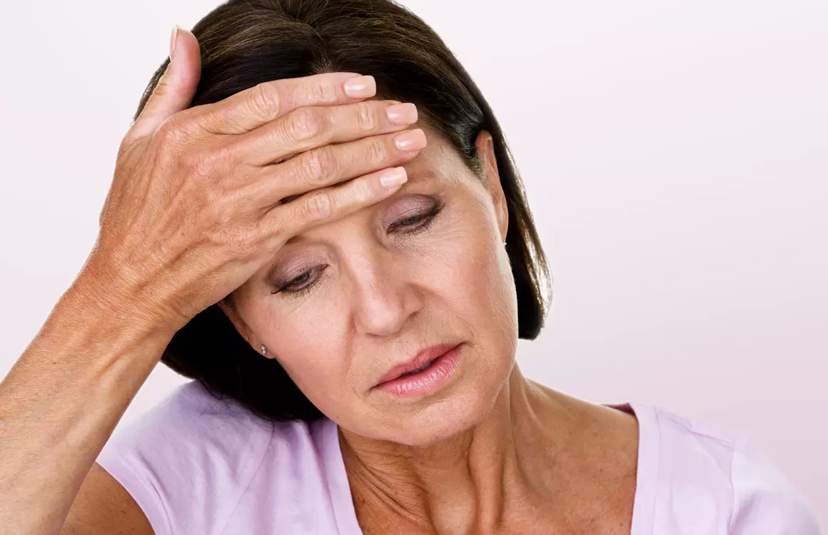 Frau mit Schwindelgefühl